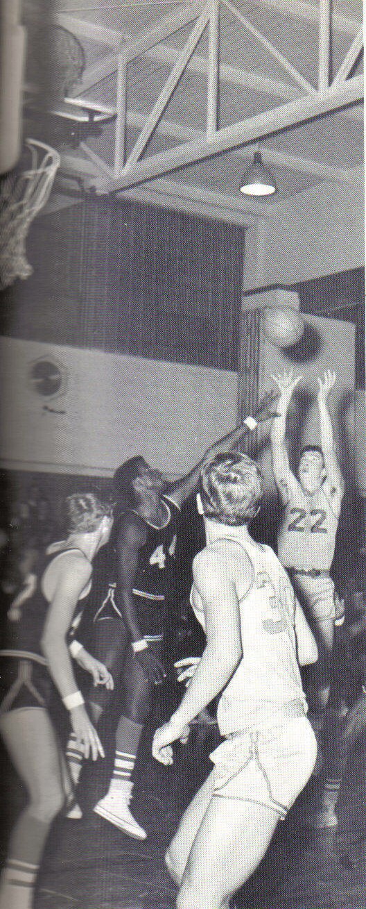 Randy Taylor puts it up with Gary Zajac assisting